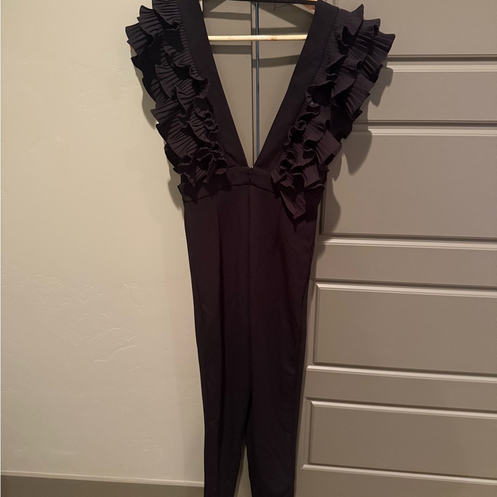 Black jumpsuit with ruffle sleeve details
